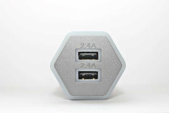 white background electronics appliances technology socket voltage current light black gray power two connection adapter plastic metal shadow gray office modern office input output usb wire two compute