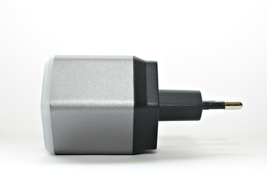white background electronics appliances technology socket voltage current light black gray power two connection adapter plastic metal shadow gray office modern office input output usb wire two compute