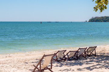 Fototapeta na wymiar Deck chairs on Sivalai beach,Koh Mook island,Thailand. February 2019.