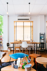 Modern French Dessert Cafe. Decorated with white color and wooden texture. Cozy and relax atmosphere. 
