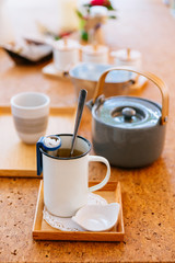 Afternoon Tea Set served hot water in gray pot with tin cup and tea infuser.