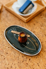 Fresh baked Canelés, A small French pastry flavored with rum and vanilla with a soft and tender custard center and a dark, thick caramelized crust.