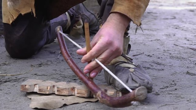 Primitive fire starting with a bow drill (fire drill) clip