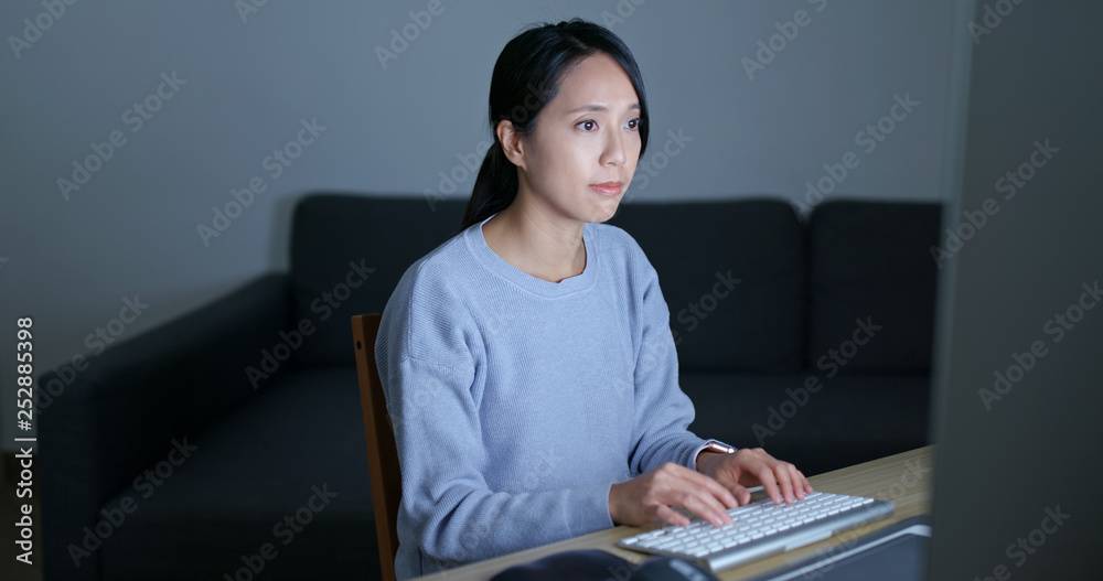 Wall mural Woman work on computer at home