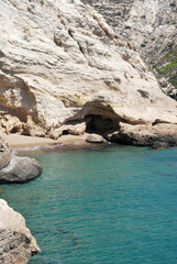 Caves in the rocky shore of the bay, Cape Fourni, Rhodes island, Greece