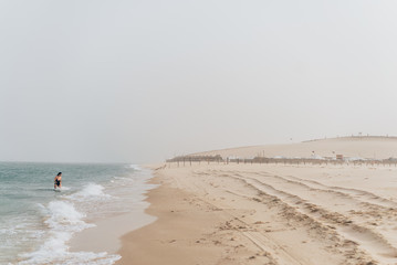 Fototapeta na wymiar Qatari desert where water intersects with the sea