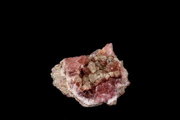 Macro mineral stone Pink Amethyst on a black background