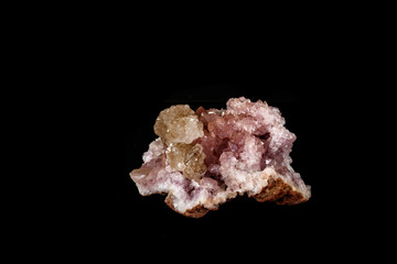 Macro mineral stone Pink Amethyst on a black background