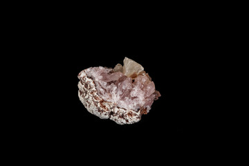 Macro mineral stone Pink Amethyst on a black background