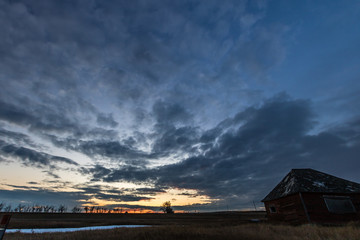 Fototapeta na wymiar Sunset over a farmers field, Gliechen, Alberta, Canada