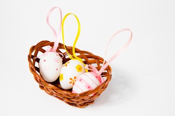 Three Ornate eggshells with ribbons in nest - eastern decoration.