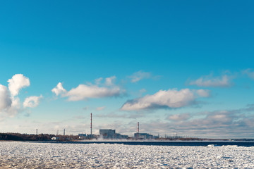 cooling towers emit steam at a nuclear power plant located on the shore of the Bay.Cooling of...