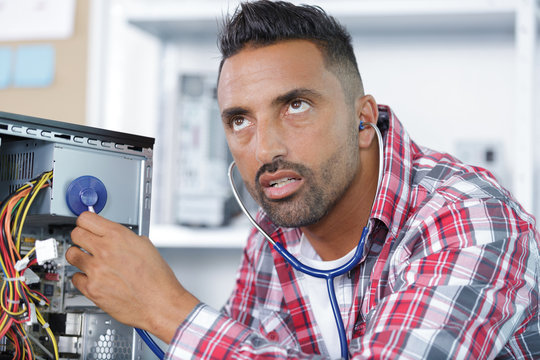man using a stetheoscope in a pc