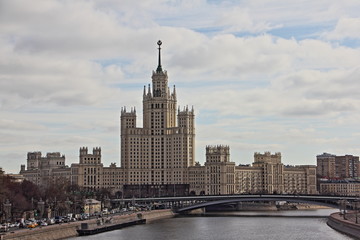 Skyscraper on Kotelnicheskaya embankment in Moscow - view from the floating bridge in early spring in Russia
