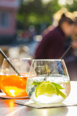 Aperol spritz and HUGO cocktail in misted glass, selective focus .