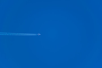 Simple winter blue sky with clouds and without, flying through the air. Natural primitive background, enlarged.