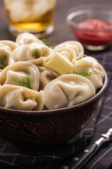 Homemade meat dumplings - russian pelmeni. Dumplings, filled with meat, ravioli. Dumplings with filling