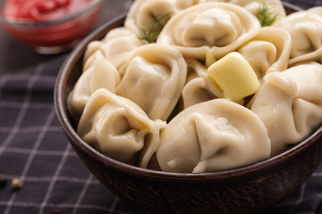 Homemade meat dumplings - russian pelmeni. Dumplings, filled with meat, ravioli. Dumplings with filling