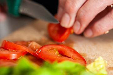 Woman cutting tomatoes