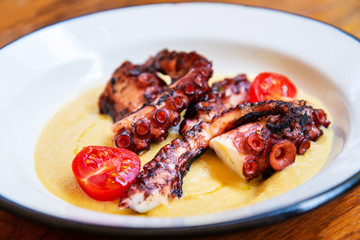 Mediterranean Octopus with vegetables and potatoes