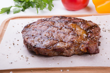 Grilled beef steak served on board
