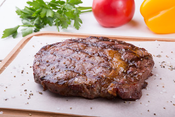Grilled beef steak served on board