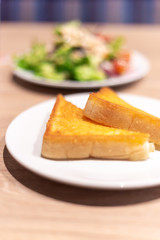 Yellow garlic bread on the table