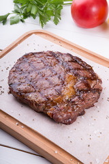 Grilled beef steak served on board