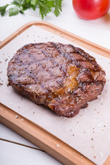 Grilled beef steak served on board