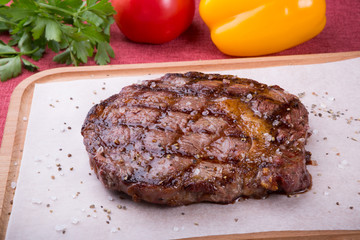 Grilled beef steak served on board