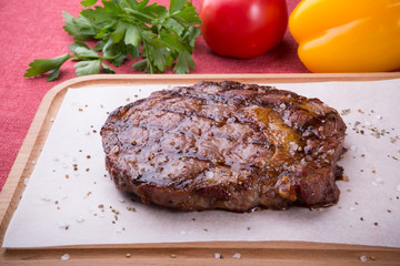 Grilled beef steak served on board