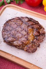Grilled beef steak served on board
