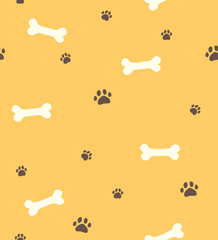 Seamless yellow pattern with bones for dog and paws
