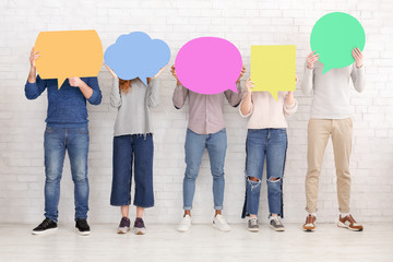 Thought bubbles. Friends holding placards with copy space