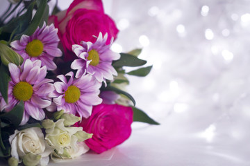 Floral festive background template. A bouquet of flowers on a light background bokeh.