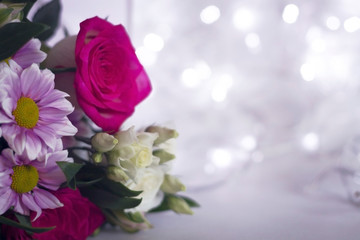 Floral festive background template. A bouquet of flowers on a light background bokeh.