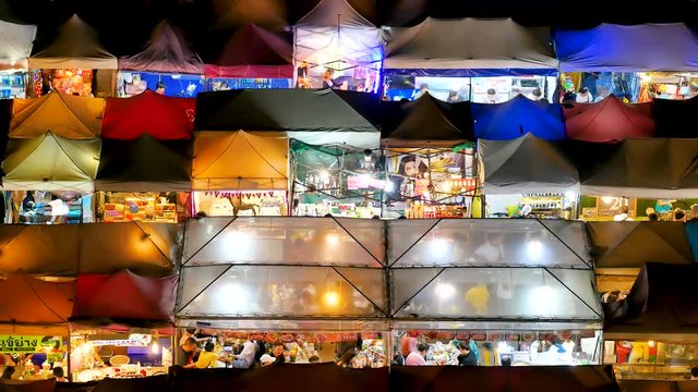 Colorful food stalls at "Ta lad Rod Fai" Train outdoor Night Market Ratchada in Bangkok, Thailand. Bangkok is the capital and most populous city of Thailand.BANGKOK THAILAND