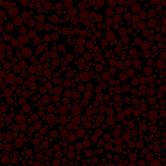 Abstract seamless pattern of circles of different sizes in red colors