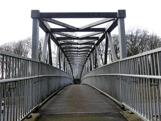Metal footbridge over the M25 Motorway, Chorleywood, Hertfordshire, UK
