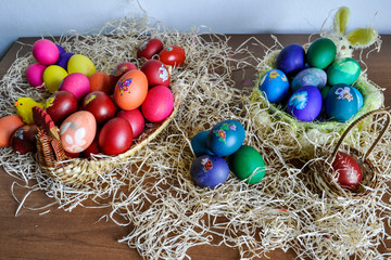 Colorful Easter eggs decorated in a basket for holiday