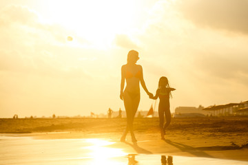 Fototapeta premium mother and daughter happy in love at sunset