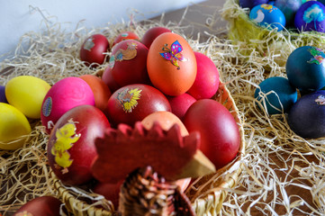 Colorful Easter eggs decorated in a basket for holiday