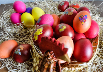 Colorful Easter eggs decorated in a basket for holiday