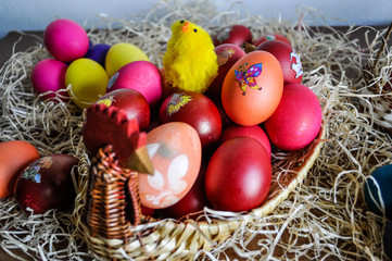 Colorful Easter eggs decorated in a basket for holiday