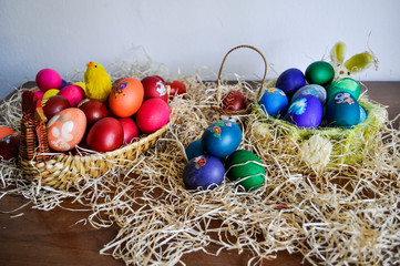 Colorful Easter eggs decorated in a basket for holiday