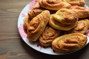 Fresh salt cake with cheese and garlic on a wooden table