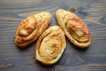 Fresh salt cake with cheese and garlic on a wooden table