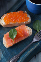 Sandwiches with red fish and caviar