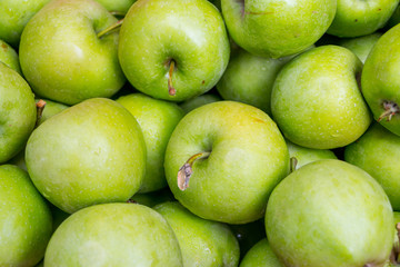 green apples in a wooden box