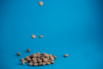 Fototapeta na wymiar pills in blue background